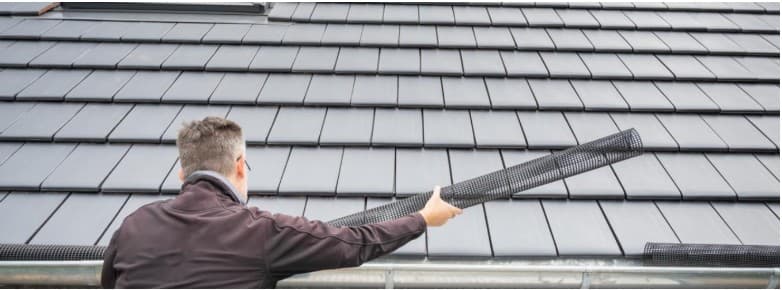 Hooded (Surface-Tension) vs Mesh Gutter Guards: 2025 Performance Showdown